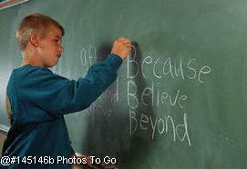 Male grade school student at blackboard